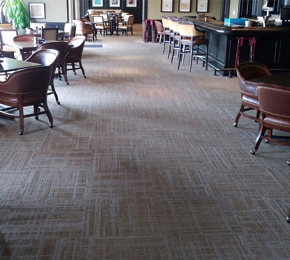 Patterned commercial carpet tile in a club dining room